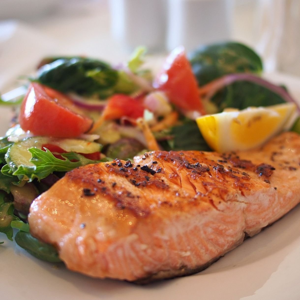 plate of salmon with green vegetables