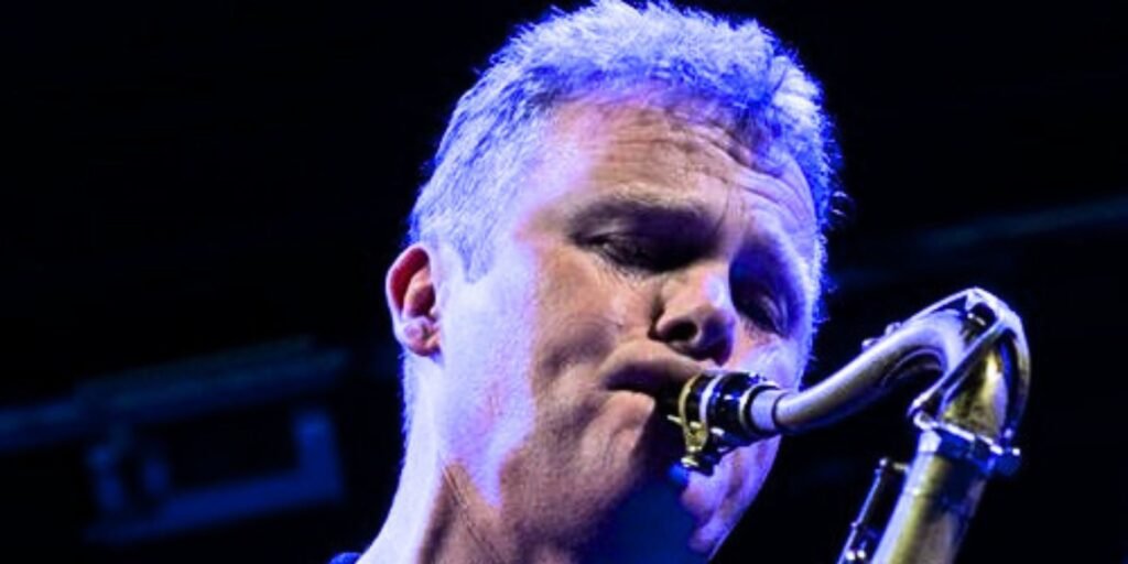 Close up of Iain blowing his sax